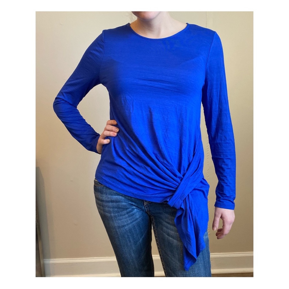 This is a beautiful size small blue long sleeve top. gently worn a hung to dry.
